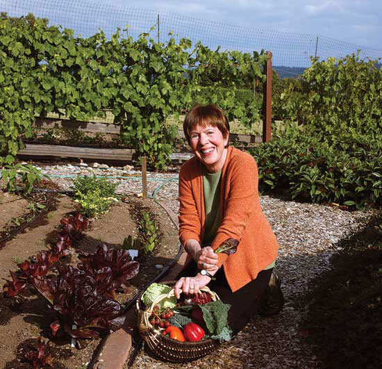 
The author, Jo Robinson, pauses to pick phytonutrient-rich crops from her bountiful garden on Vashon Island, Wash.
